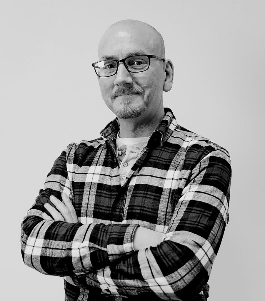 Black and white portrait photo of Neil Robinson